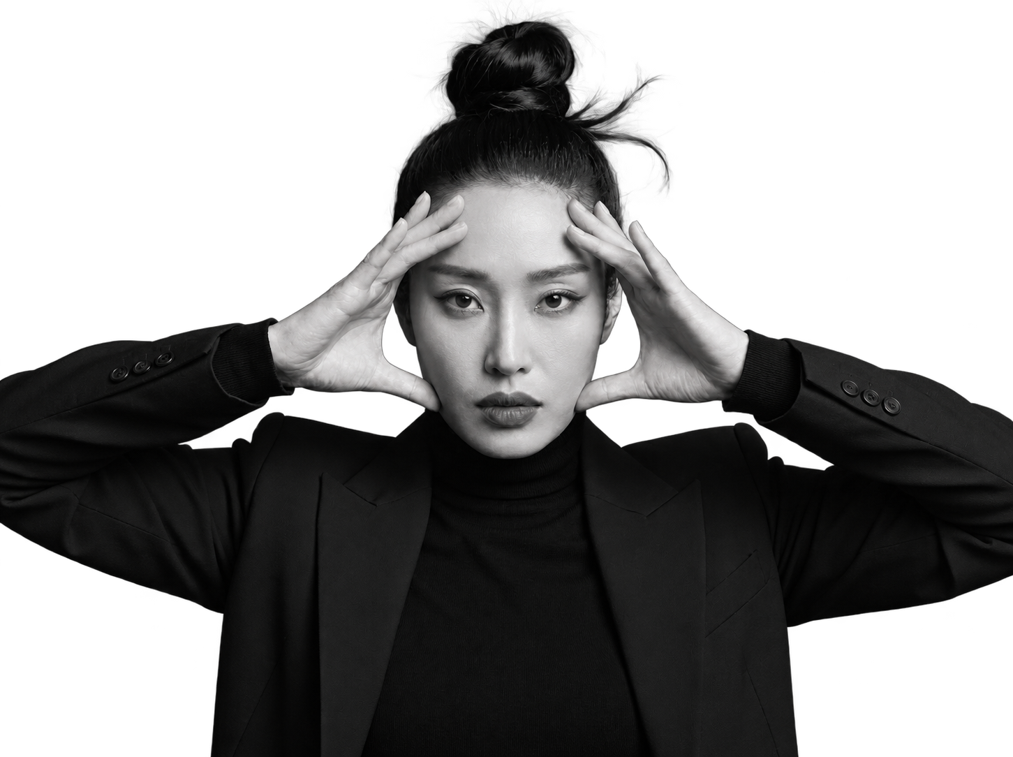 Heewon Kim with her hands framing her face